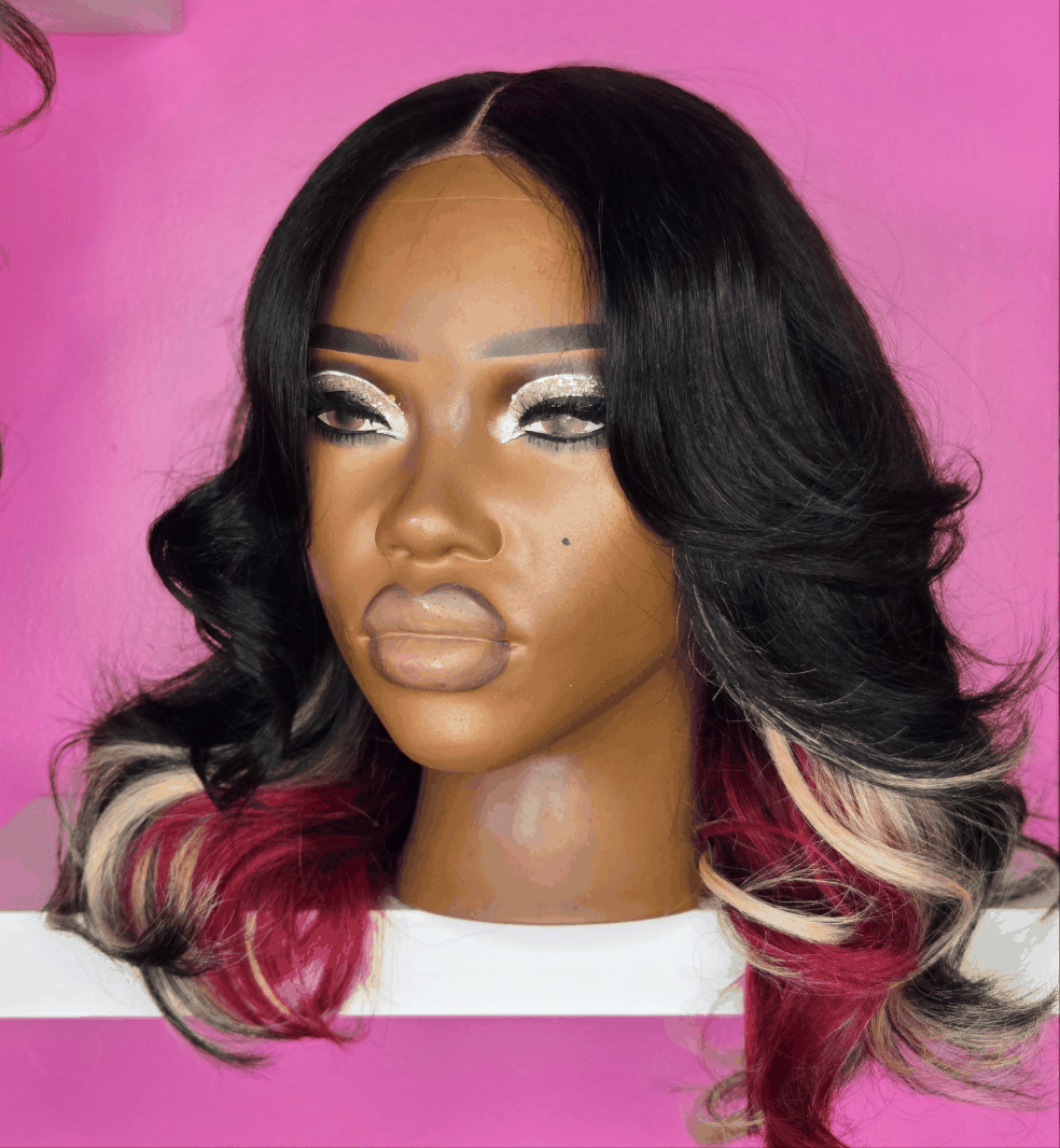 21” canvas head with black hair, red and blonde highlights, pre-plucked middle part, 2x6 transparent lace closure.